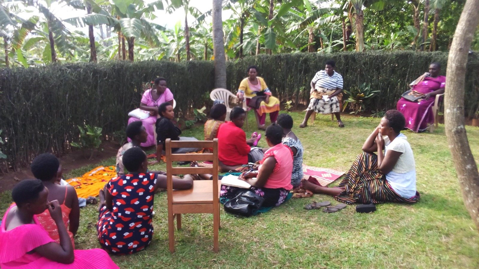 A community group seated in a circle during a discussion