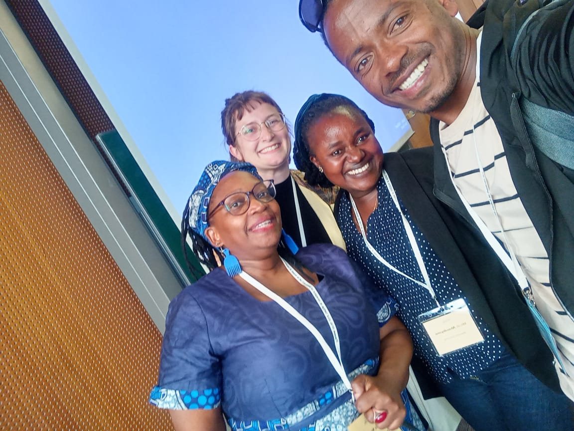 Conference participants taking a group selfie in Cologne, Germany