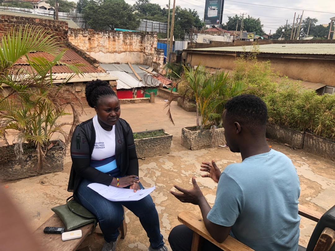 A researcher interviewing a participant during fieldwork