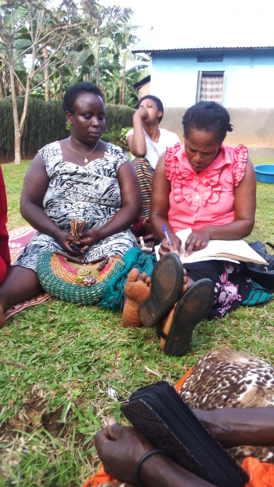 Participants taking notes during an outdoor field research activity