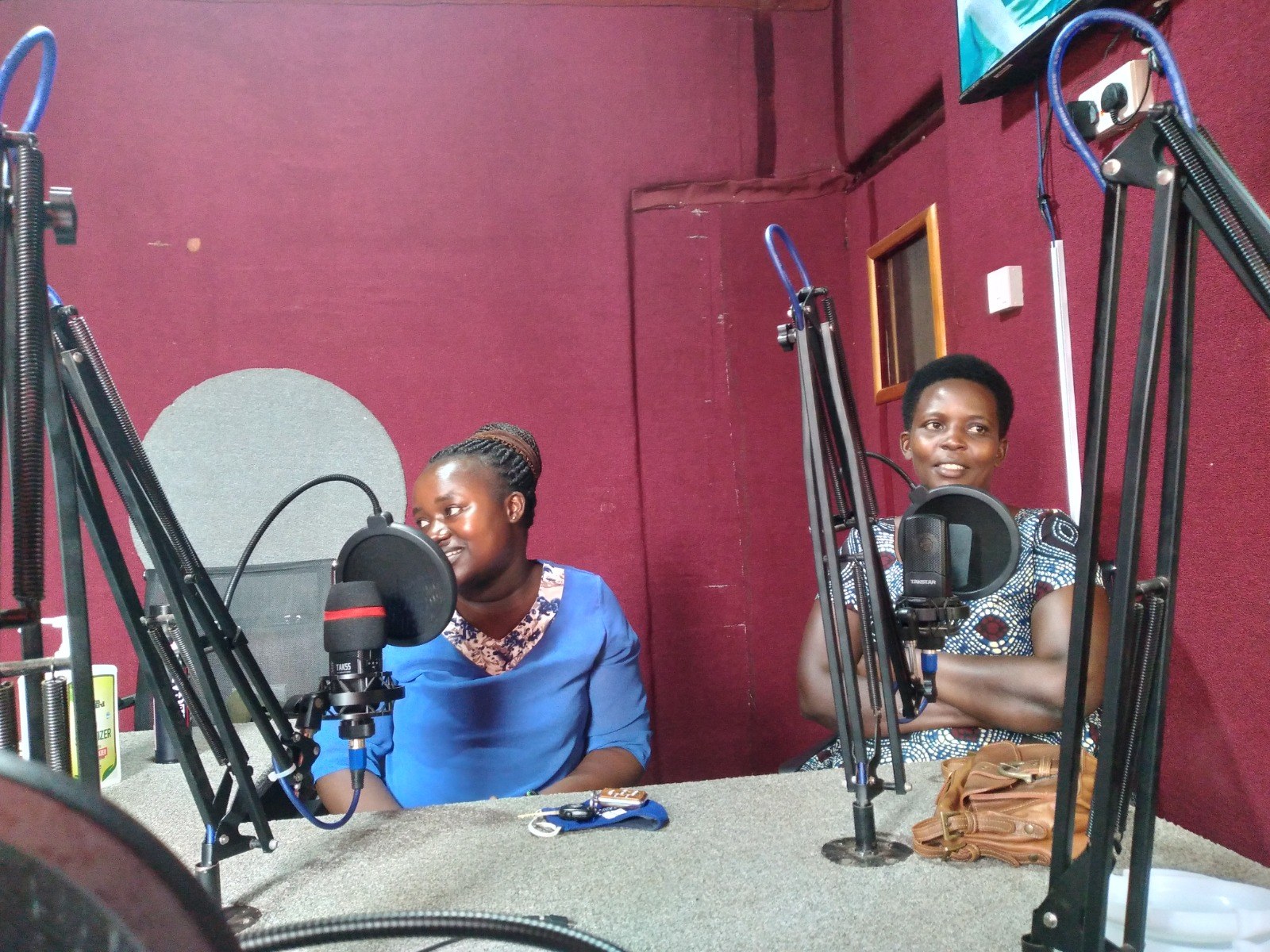 Researchers speaking during a radio engagement