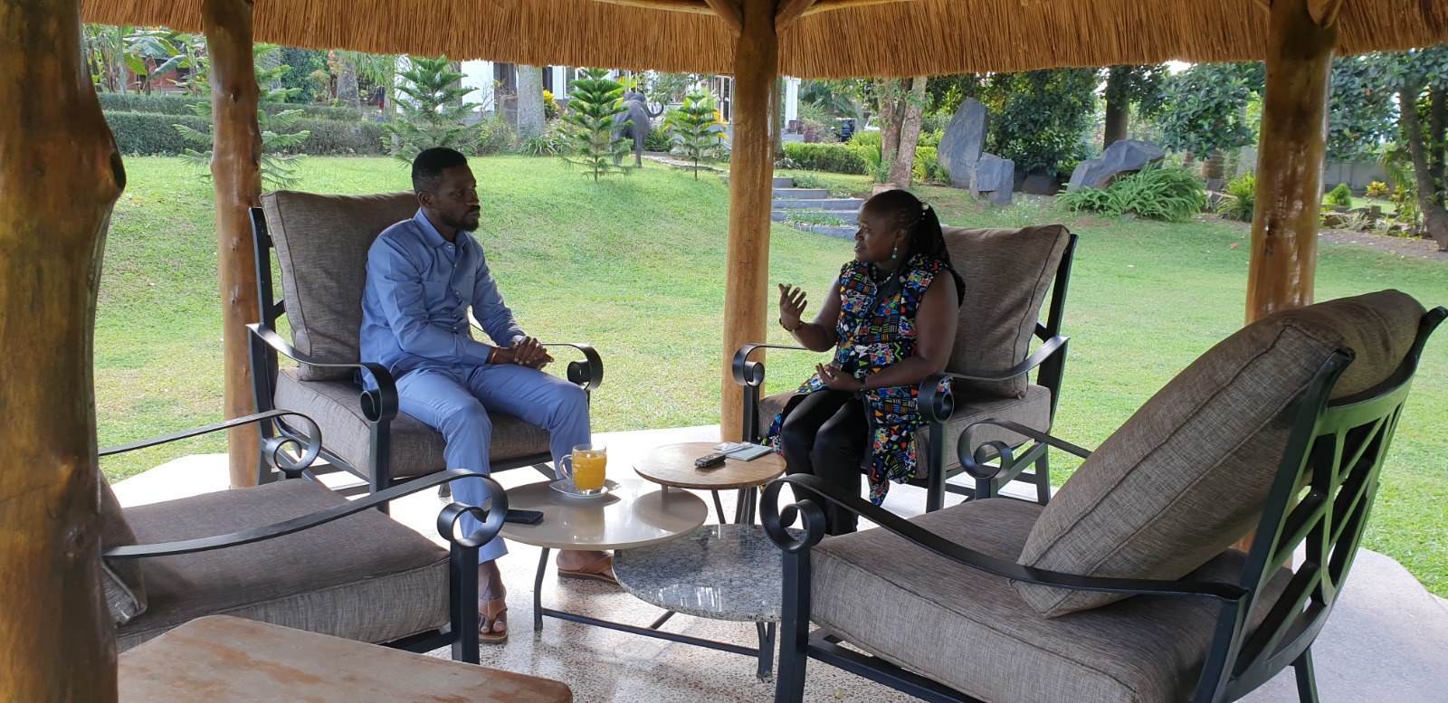 A researcher conducting an interview in an outdoor setting