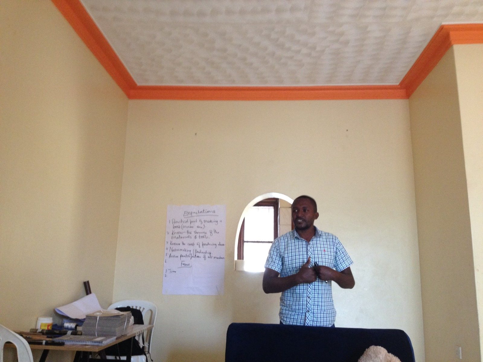Facilitator leading an indoor research training session