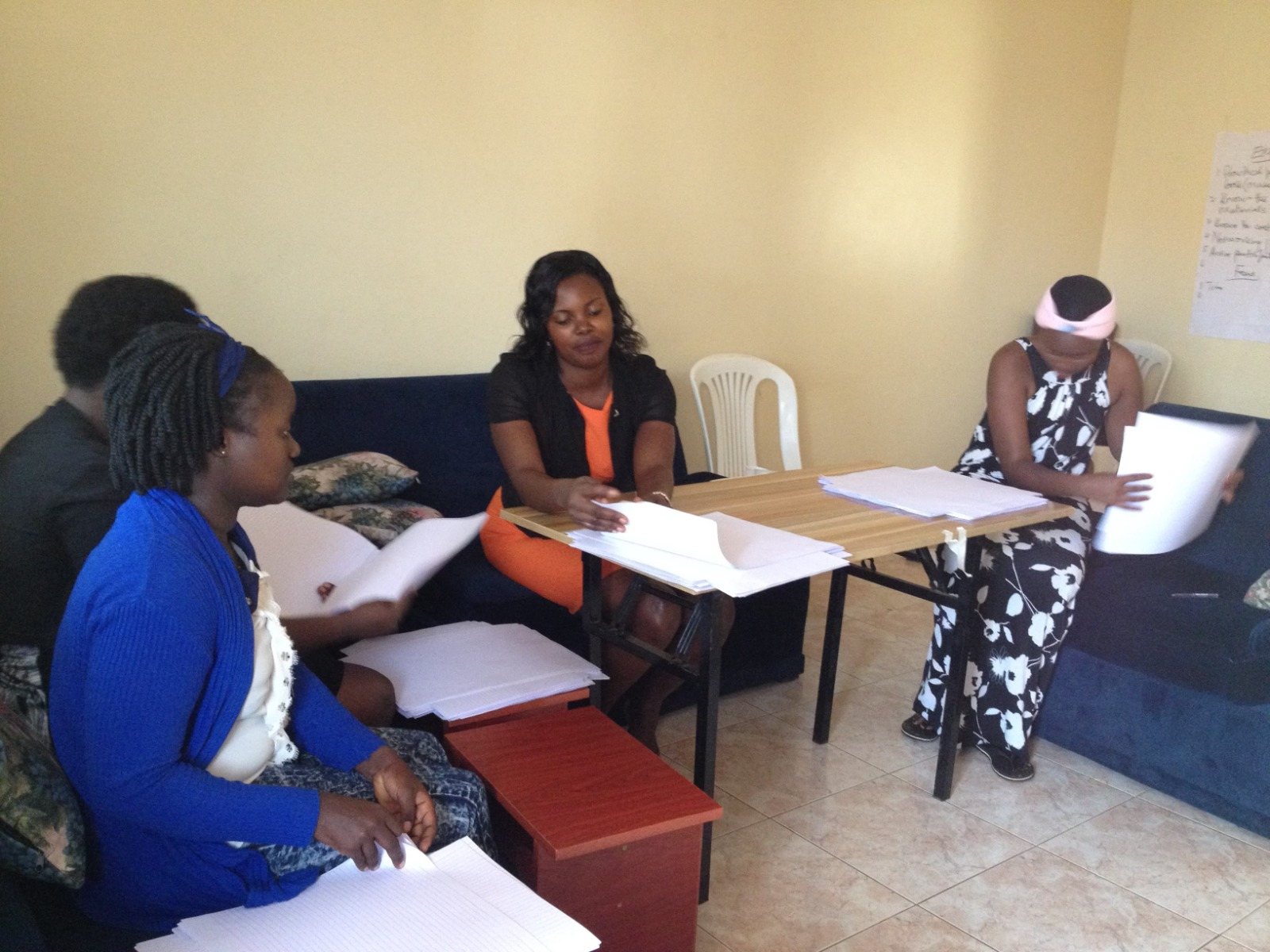 Participants reviewing documents together in a workshop